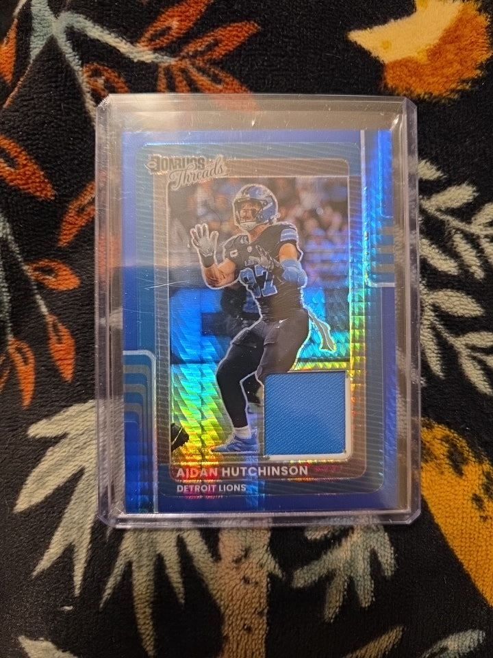 2025 Panini Donruss Optic - Aidan Hutchinson Blue Prizm Threads Lions